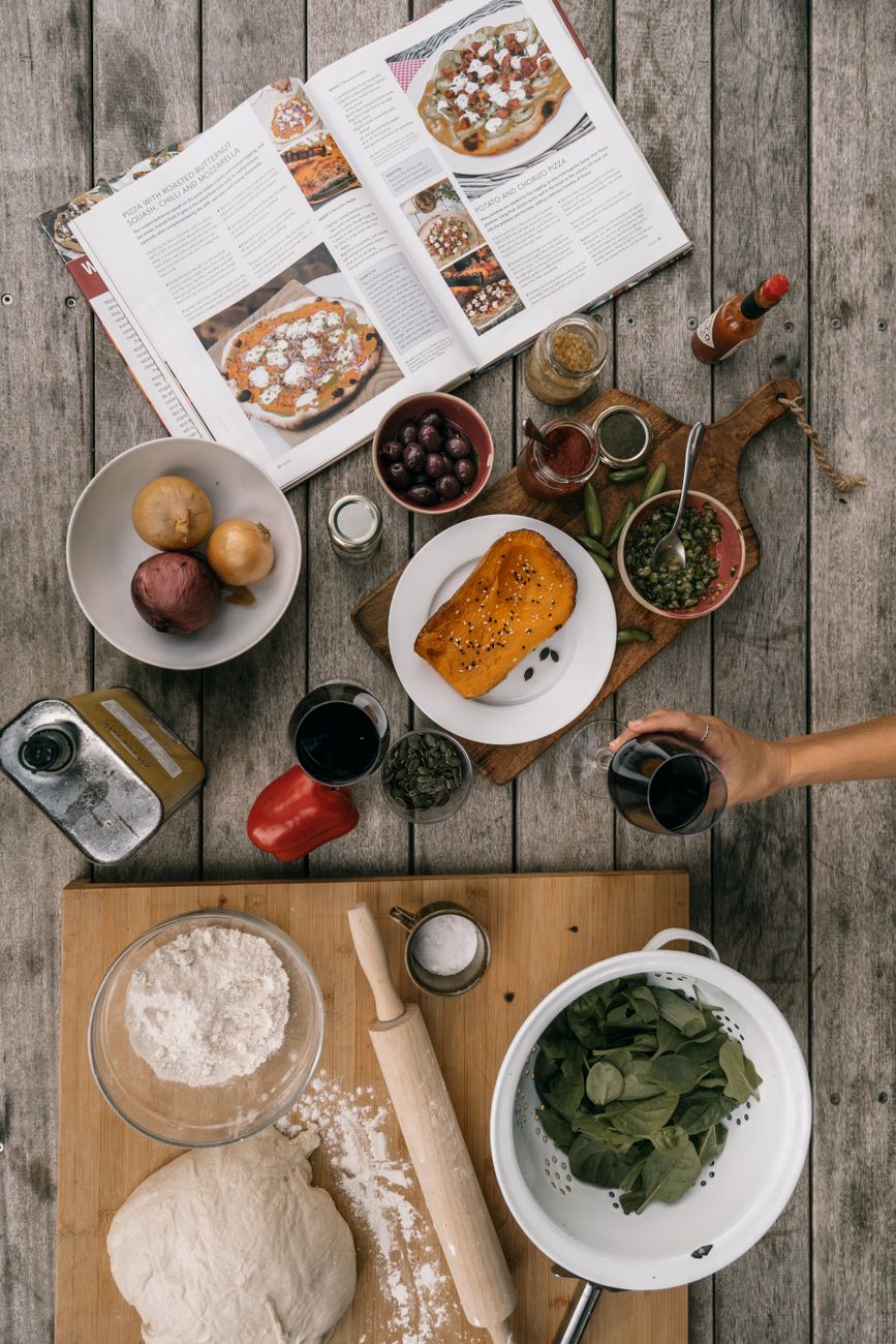 Traditional Aegean table overlooking the sea with olive oil, fresh sourdough, and figs